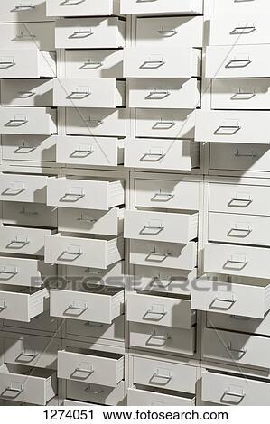 A white cabinet with drawers opened at varying degrees View Large Photo Image Stock Image - A white cabinet with drawers opened at varying degrees. Fotosearch