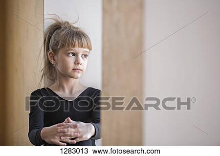 A young girl looking contemplative View Large Photo Image Stock Image - A young girl looking contemplative. Fotosearch