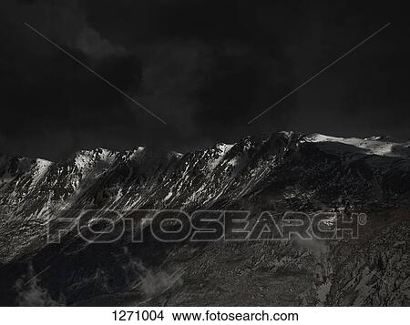 An ominous sky above a mountain range View Large Photo Image Picture - An ominous sky above a mountain range. Fotosearch