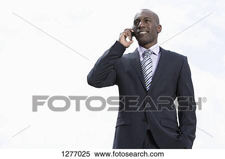 Happy businessman on phone View Large Photo Image Stock Photography - Happy businessman on phone. Fotosearch