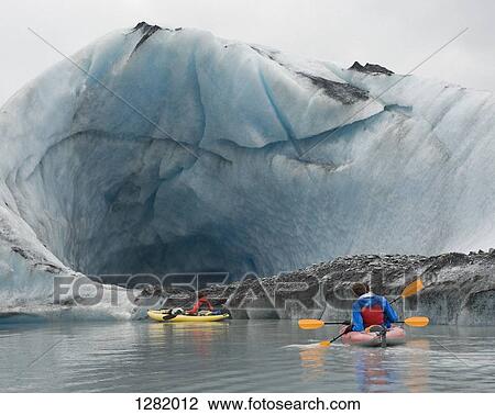 Kayaking beside ice cave at Valdez Glacier, Alaska, USA View Large Photo Image Stock Image - Kayaking beside ice cave at Valdez Glacier, Alaska, USA. Fotosearch