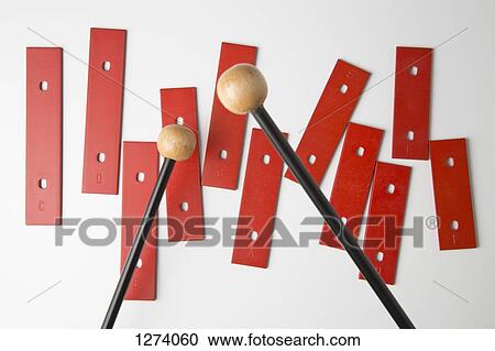 Mallets preparing to play bars from a xylophone missing its base View Large Photo Image Stock Image - Mallets preparing to play bars from a xylophone missing its base. Fotosearch