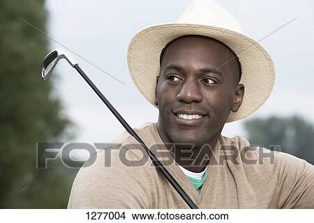 Man relaxing at the golf course View Large Photo Image Picture - Man relaxing at the golf course. Fotosearch