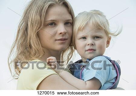 Mother and daughter cheek to cheek View Large Photo Image Stock Photography - Mother and daughter cheek to cheek. Fotosearch