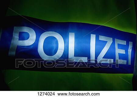 Polizei (Police in German) written on the back of a reflection jacket, back lit View Large Photo Image Picture - Polizei (Police in German) written on the back of a reflection jacket, back lit. Fotosearch