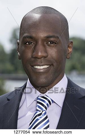 Picture - Portrait of smiling businessman. Fotosearch