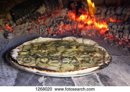 Potato and rosemary pizza baking in oven View Large Photo Image Stock Image - Potato and rosemary pizza baking in oven. Fotosearch