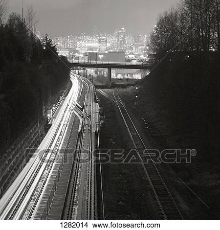Railway tracks leading to city skyline of Vancouver, British Columbia, Canada View Large Photo Image Picture - Railway tracks leading to city skyline of Vancouver, British Columbia, Canada. Fotosearch
