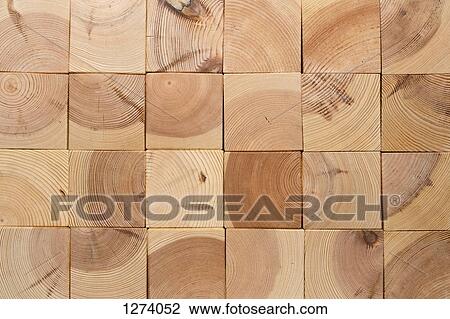 Stock Image - Square shaped wooden blocks arranged into a grid, full frame. Fotosearch
