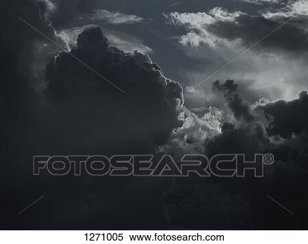 Sun breaking through storm clouds View Large Photo Image Stock Photography - Sun breaking through storm clouds. Fotosearch
