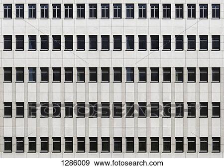 Stock Photo - The facade of an office building, full frame. Fotosearch