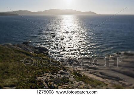 The sun shining on the Mediterranean Sea, Calvi, Corsica, France View Large Photo Image Stock Photo - The sun shining on the Mediterranean Sea, Calvi, Corsica, France. Fotosearch
