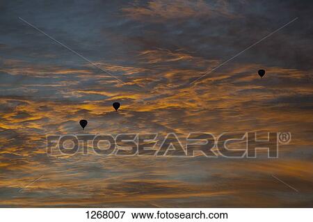Three silhouetted hot air balloons against a dusk sky in Melbourne, Victoria, Australia View Large Photo Image Stock Photo - Three silhouetted hot air balloons against a dusk sky in Melbourne, Victoria, Australia. Fotosearch