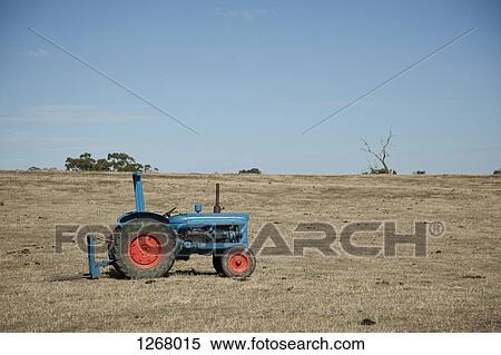 Tractor on empty field View Large Photo Image Stock Photography - Tractor on empty field. Fotosearch