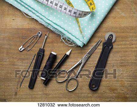 Various sewing equipment arranged on a wooden surface View Large Photo Image Stock Image - Various sewing equipment arranged on a wooden surface. Fotosearch