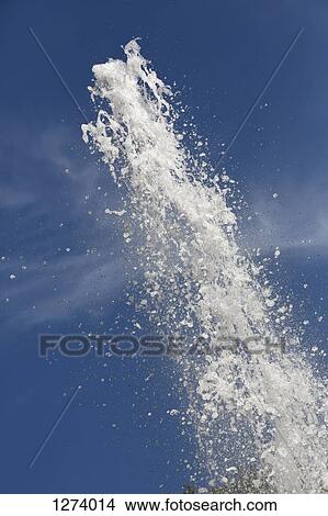 Picture - Water spraying up from a fountain, close-up. Fotosearch