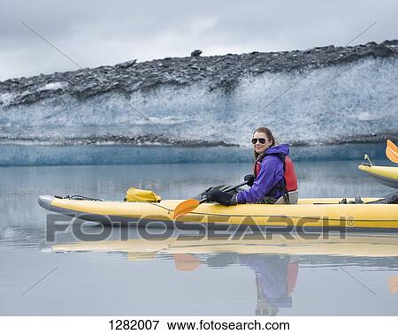 Woman kayaking at Valdez Glacier, Alaska, USA View Large Photo Image Stock Photo - Woman kayaking at Valdez Glacier, Alaska, USA. Fotosearch