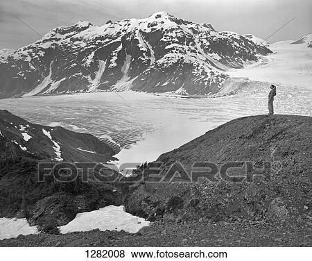 Woman looking at view at Leduc Glacier, British Columbia, Canada, View Large Photo Image Stock Photo - Woman looking at view at Leduc Glacier, British Columbia, Canada,. Fotosearch