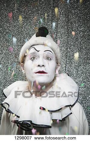 A clown watching confetti fall on stage View Large Photo Image Stock Photo - A clown watching confetti fall on stage. Fotosearch