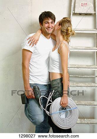 A couple embracing each other View Large Photo Image Stock Photo - A couple embracing each other. Fotosearch