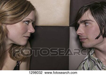 Stock Image - A couple looking at each other intensely, close-up. Fotosearch