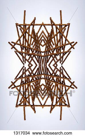 A digital composite of mirrored images of an arrangement of pretzels View Large Photo Image Picture - A digital composite of mirrored images of an arrangement of pretzels. Fotosearch