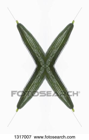 A digital composite of mirrored images of cucumbers in the shape of an X View Large Photo Image Stock Photo - A digital composite of mirrored images of cucumbers in the shape of an X. Fotosearch
