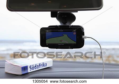 A GPS and South African guidebook on car dashboard View Large Photo Image Picture - A GPS and South African guidebook on car dashboard. Fotosearch