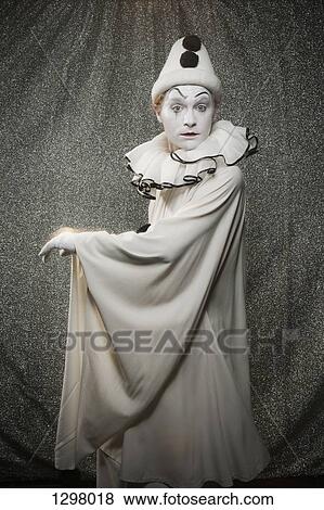 Stock Photo - A serious clown on stage. Fotosearch