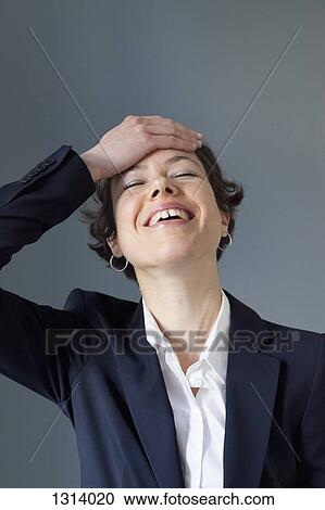 A smiling mid adult woman having an aha moment, close-up View Large Photo Image Stock Image - A smiling mid adult woman having an aha moment, close-up. Fotosearch