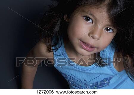 A smiling young girl, close-up View Large Photo Image Stock Photograph - A smiling young girl, close-up. Fotosearch