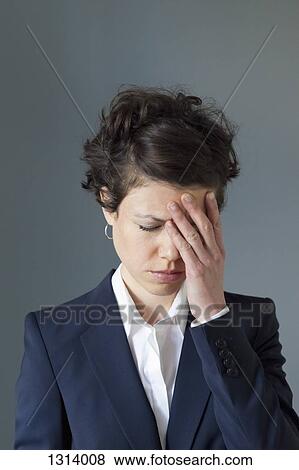 A stressed looking mid adult woman with hand covering face View Large Photo Image Stock Photo - A stressed looking mid adult woman with hand covering face. Fotosearch