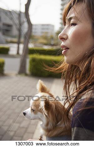 A woman with dog looking away View Large Photo Image Stock Image - A woman with dog looking away. Fotosearch