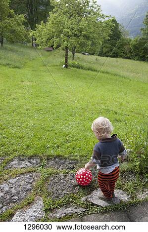 Baby boy playing with ball View Large Photo Image Stock Image - Baby boy playing with ball. Fotosearch