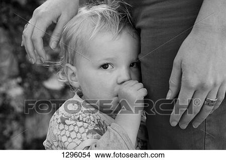 Baby boy with mother, looking at camera View Large Photo Image Picture - Baby boy with mother, looking at camera. Fotosearch