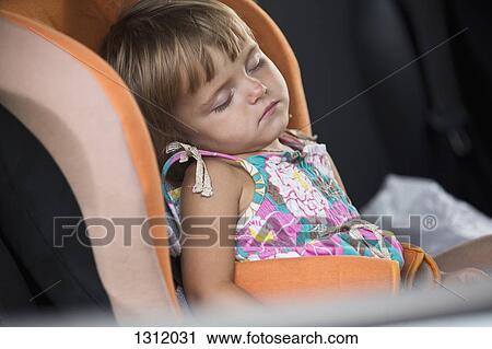Baby girl sleeping on vehicle seat View Large Photo Image Stock Image - Baby girl sleeping on vehicle seat. Fotosearch