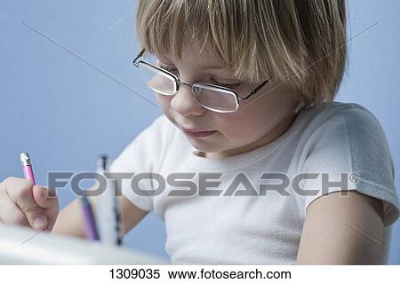 Boy doing homework, close-up View Large Photo Image Stock Photography - Boy doing homework, close-up. Fotosearch