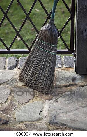 Broom leaning near railing View Large Photo Image Stock Photo - Broom leaning near railing. Fotosearch