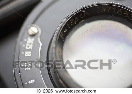 Stock Photograph - Camera lens, close-up. Fotosearch