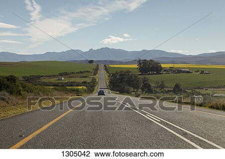 Cars on a road leading to the Riviersonderend Mountains, South Africa View Large Photo Image Stock Image - Cars on a road leading to the Riviersonderend Mountains, South Africa. Fotosearch