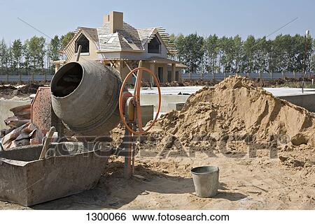 Cement mixer at construction site View Large Photo Image Stock Photograph - Cement mixer at construction site. Fotosearch