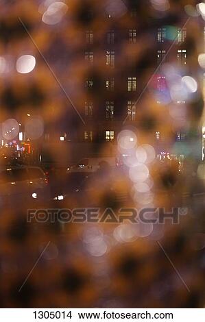 Picture - City street at night, defocused. Fotosearch
