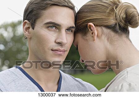 Stock Photo - Close up of young couple. Fotosearch