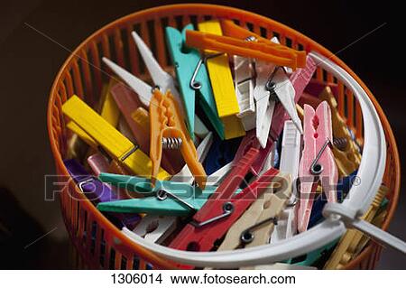 Clothes pegs in basket, close -up View Large Photo Image Picture - Clothes pegs in basket, close -up. Fotosearch