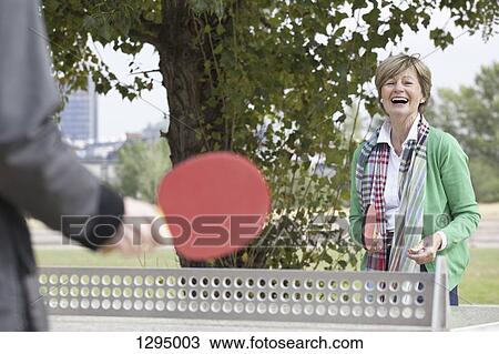 Couple playing table tennis View Large Photo Image Stock Image - Couple playing table tennis. Fotosearch