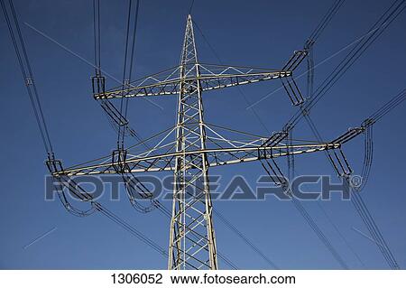 Stock Image - Electricity lines against blue sky. Fotosearch