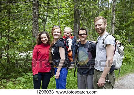 Family and friends in forest, smiling View Large Photo Image Stock Image - Family and friends in forest, smiling. Fotosearch