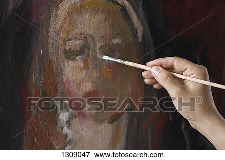 Stock Photo - Female artist painting, close-up. Fotosearch