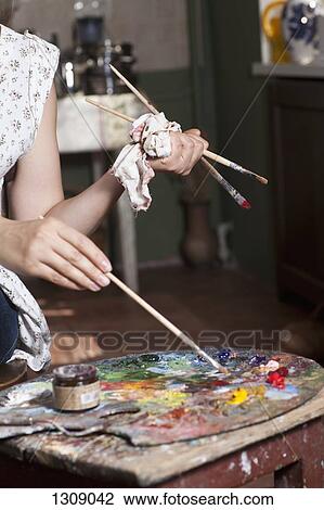 Female artist using palette, close-up View Large Photo Image Stock Image - Female artist using palette, close-up. Fotosearch