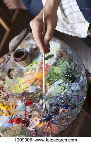 Female artist using palette, close-up View Large Photo Image Stock Photograph - Female artist using palette, close-up. Fotosearch